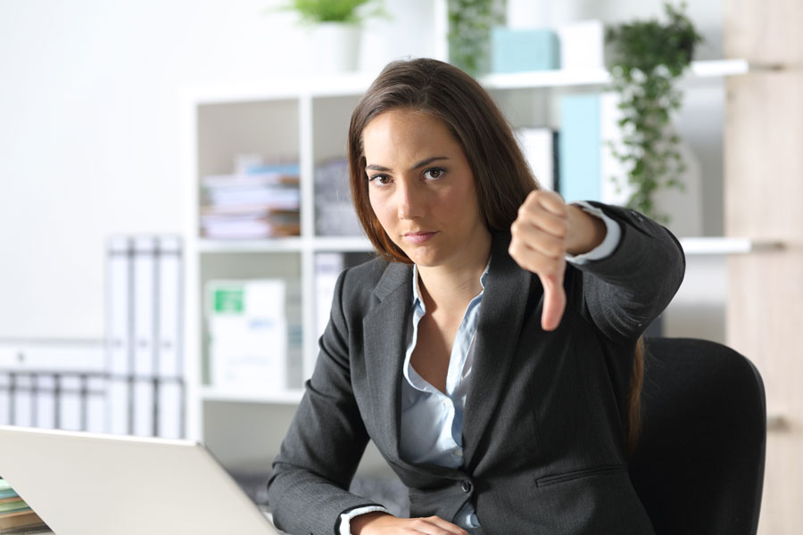 A woman with a thumbs down 