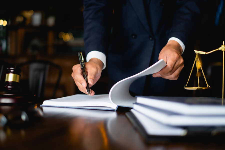 Lawyer reviewing wages of client